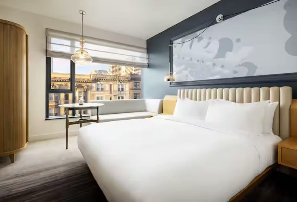Unwind in crisp linens with a skyline-framed window seat.