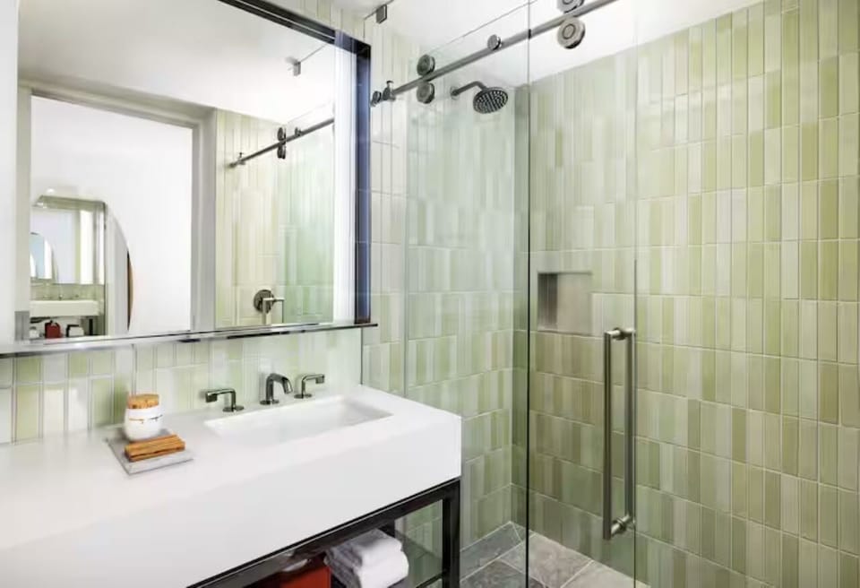 Refresh under a spa-like rainfall shower in calming tile.