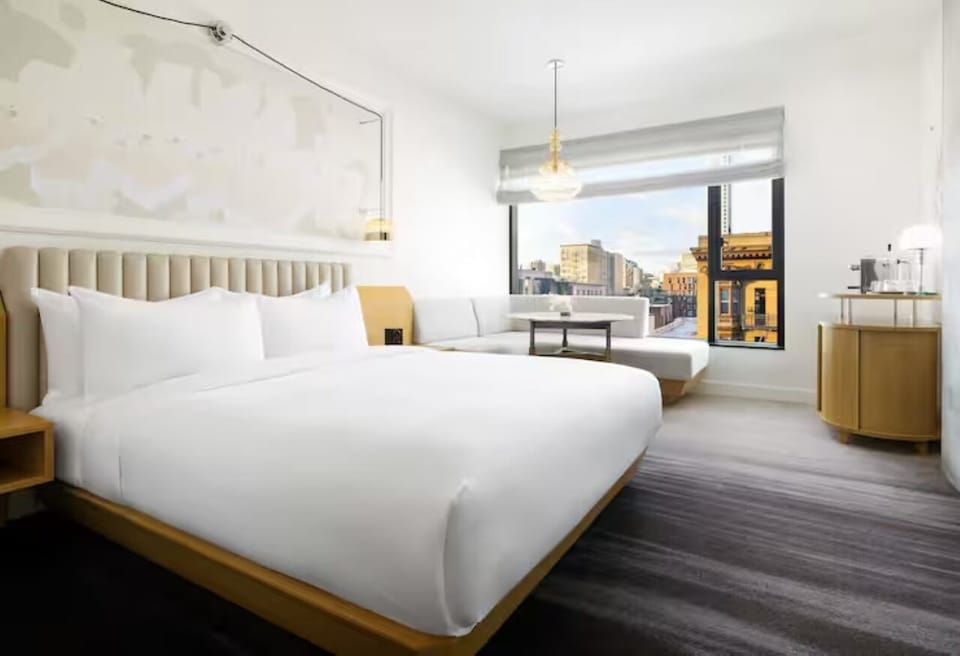 Wake up to sunlit comfort and panoramic downtown views.