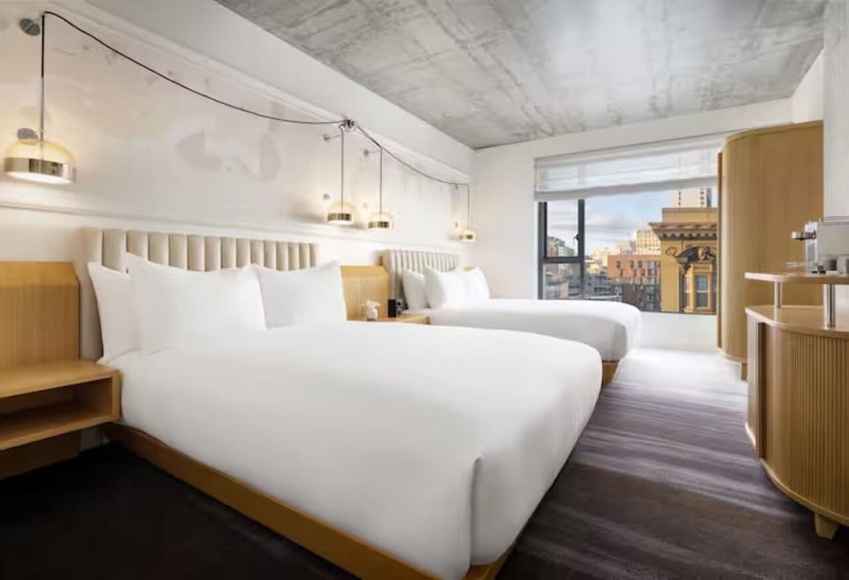 Stretch out across two plush beds after city adventures.