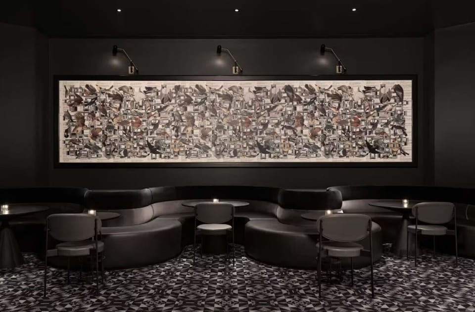 Relax on curved banquettes beneath artful lighting and rich textures.