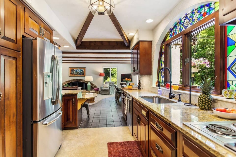 Kitchen features double oven, French door refrigerator and breakfast bar