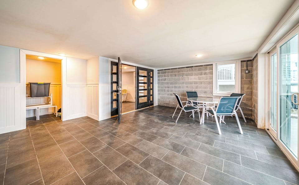 Spacious Indoor Lounge with Stylish Tile Flooring & Patio Access