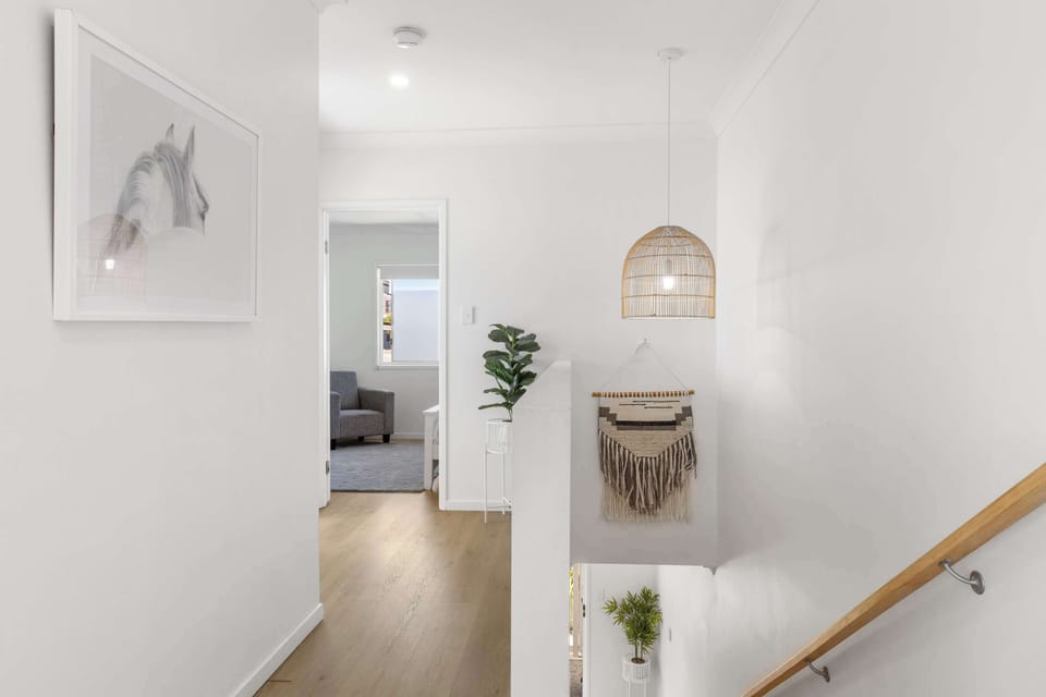 Modern design ✨ with clean lines and a bright, open feel. Stylish staircase leading to the bedrooms upstairs.
