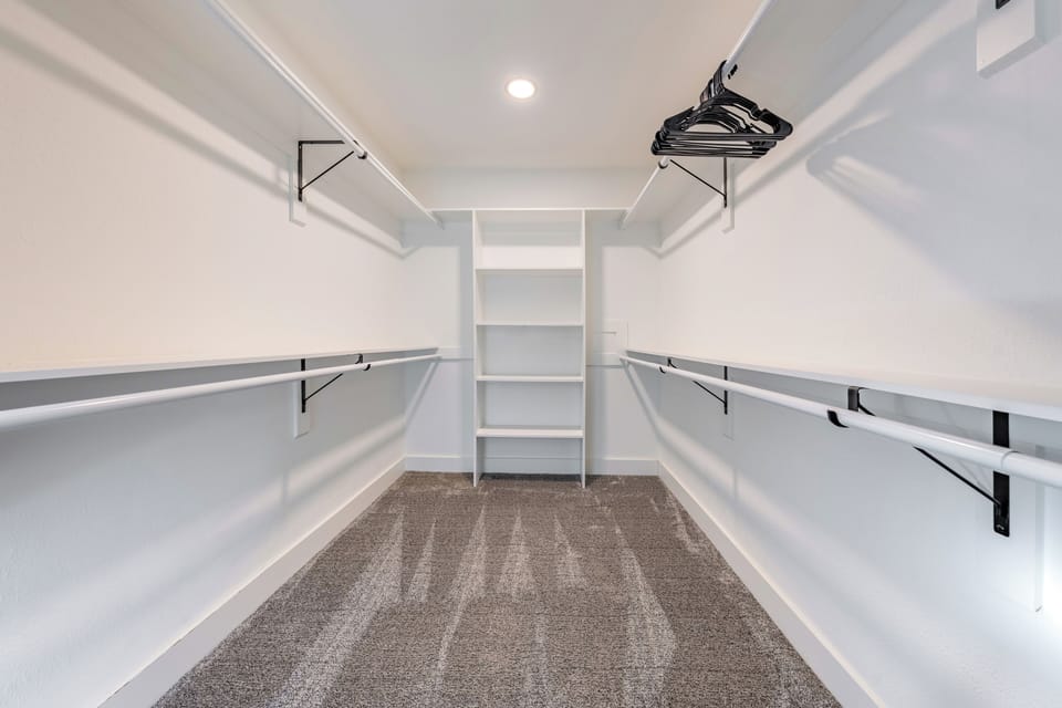 Primary bedroom's walk-in closet.