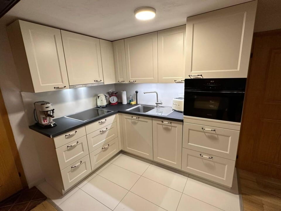 Flooring, Cabinetry, Drawer, Kitchen, Wood Stain, Cupboard, Countertop, Sink, Wood Flooring