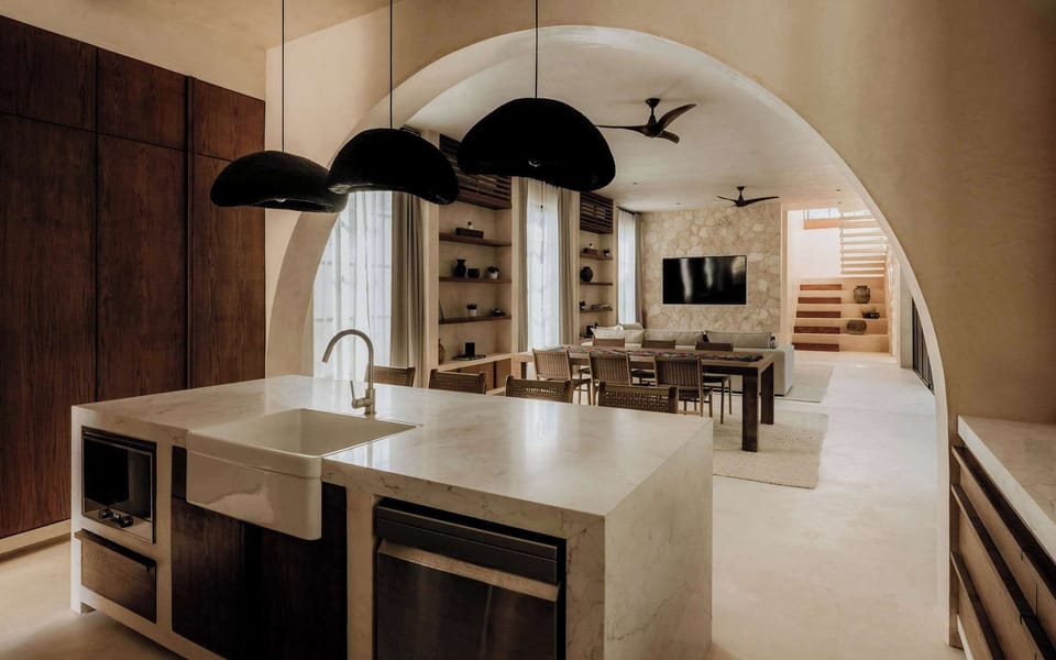 A sleek open kitchen with arched details and room to entertain.