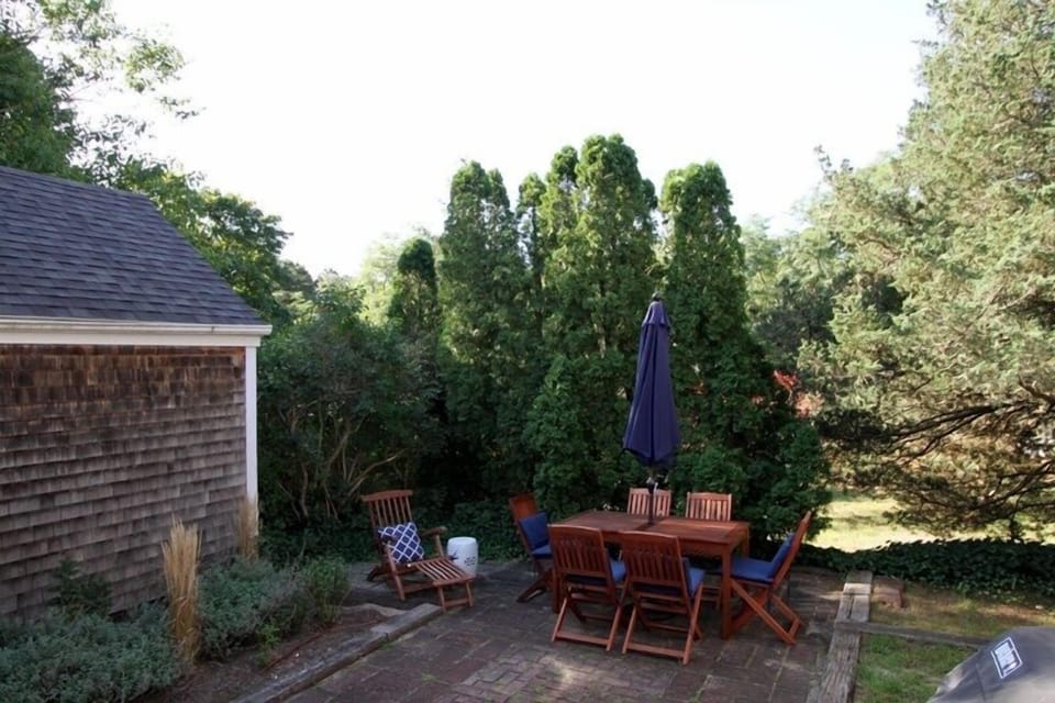 Outside Patio Area with Dining Table and Chairs