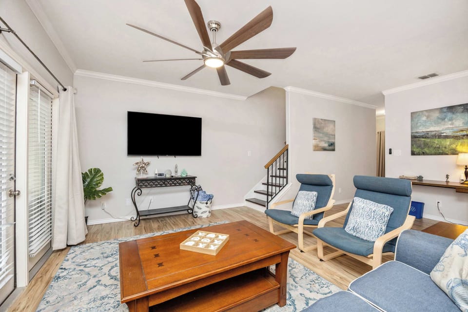 Bright living area with sofa and Smart TV