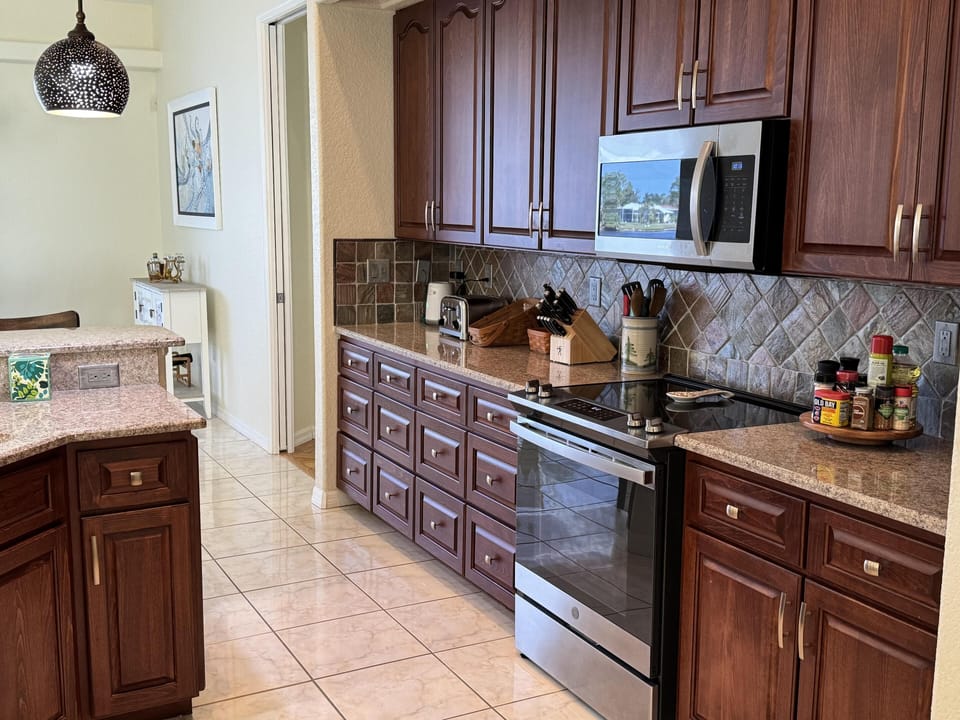 Bright, fully-equipped kitchen with plenty of counter space and new appliances