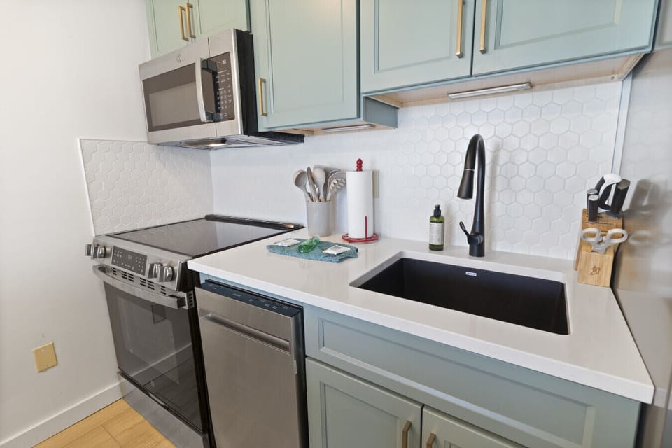 New kitchen with stainless steel appliances
