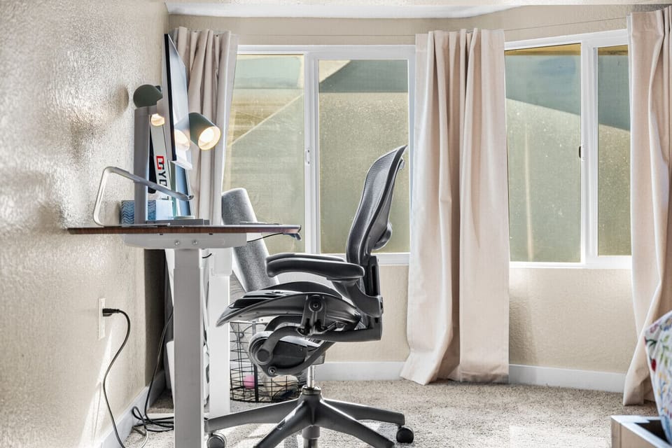 The desk also comes with an ergonomic chair and extra monitor