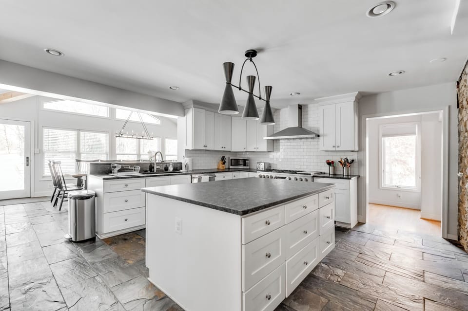 Gourmet Kitchen: Culinary adventures await in this stylish, sunlit space with modern appliances!