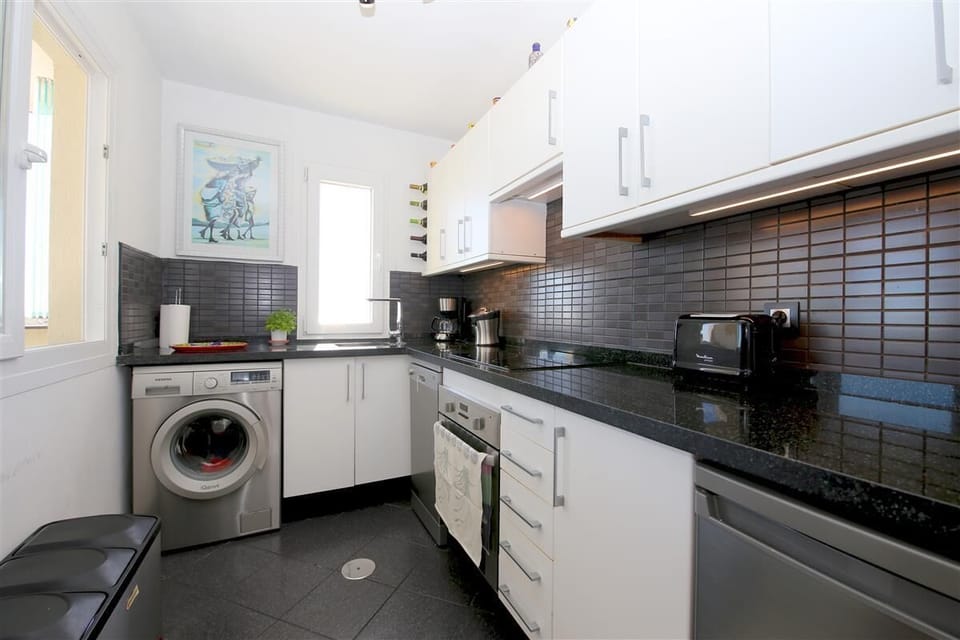 Modern kitchen is fully equipped with quality appliances