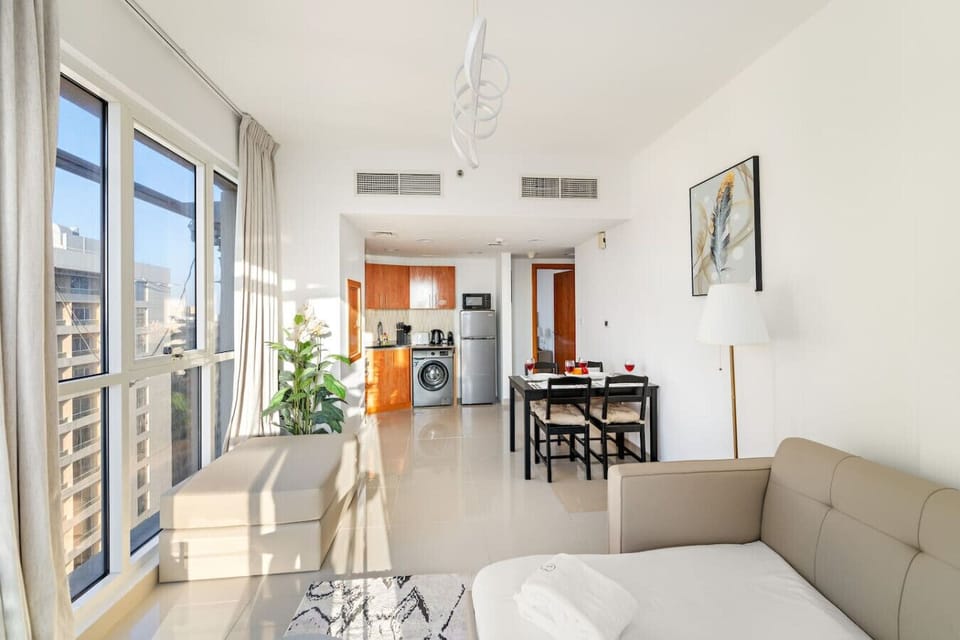 Living Room: Bright and airy space with modern decor, perfect for lounging and dining after adventures!