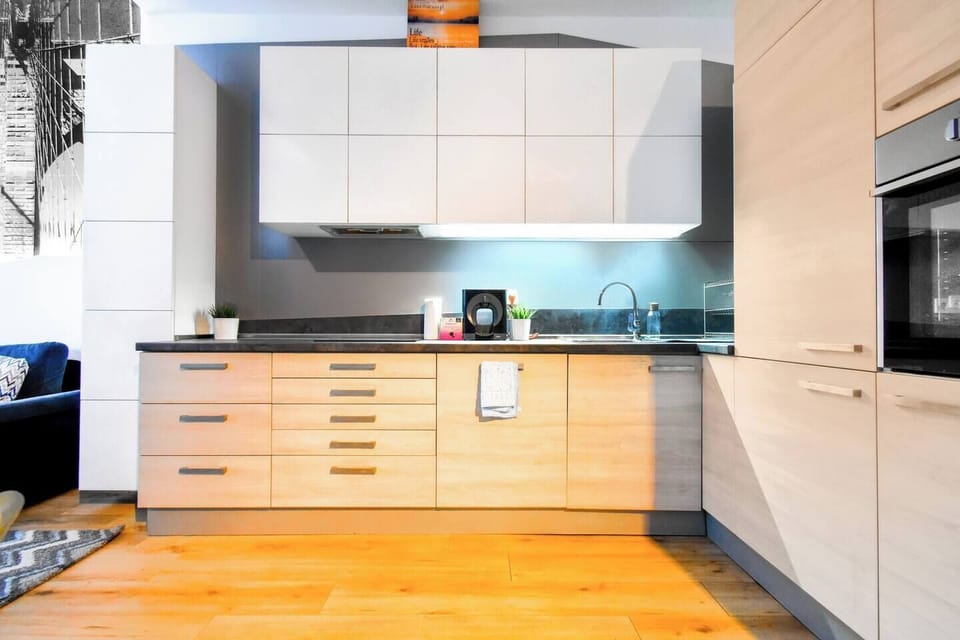 The kitchen offers a perfect balance of functionality and style, featuring ample counter space and high-quality appliances. Contact us for availability!