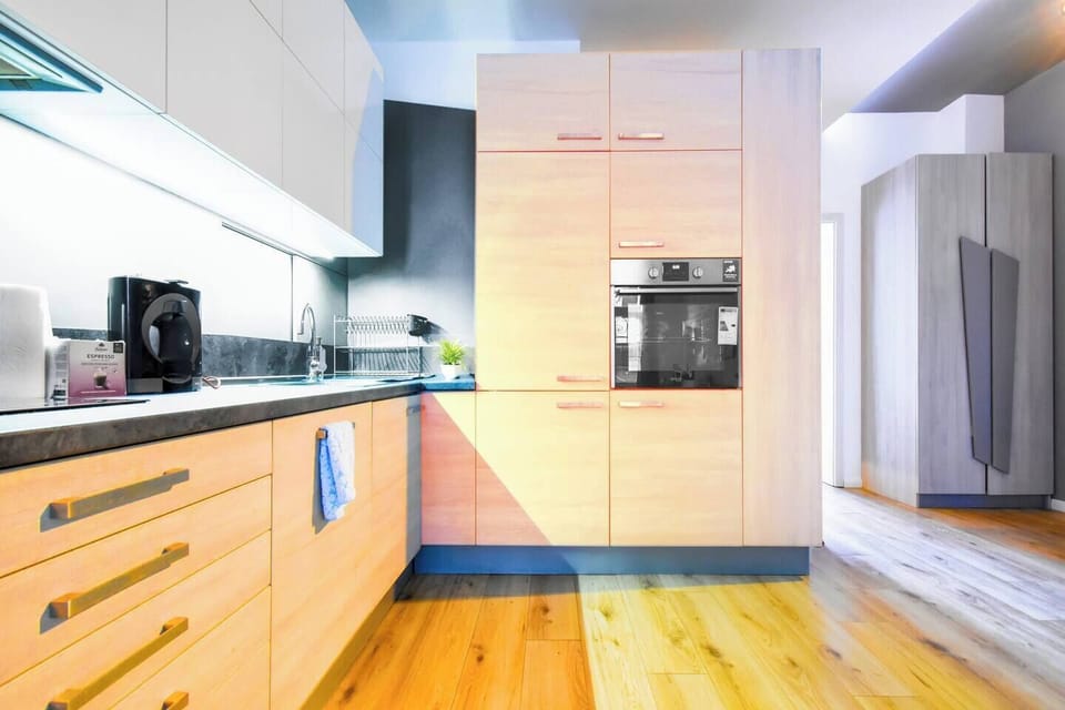 Cook like a chef in this fully equipped modern kitchen, featuring sleek appliances and everything you need for a home-cooked meal. Reserve your dates today!