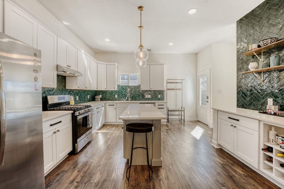 Fully equipped kitchen with spacious counters and a clean, open layout.