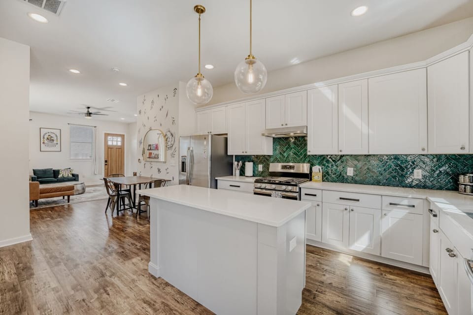 Fully equipped kitchen featuring a large island and updated finishes.