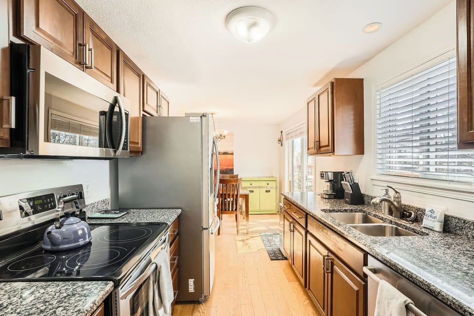 Your fully equipped galley kitchen features granite counters, stainless appliances, and everything needed to create memorable meals together.