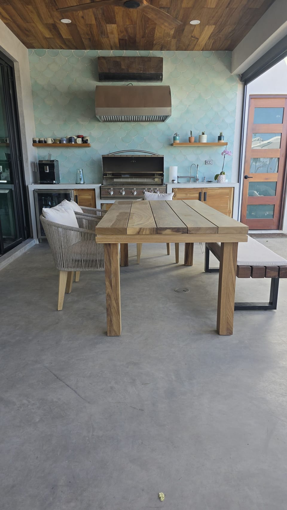 Outdoor kitchen with 8 person dinning table