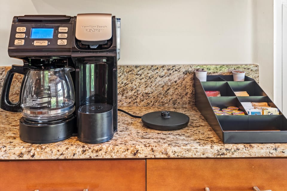 Drip & Pod Coffee maker with a selection of coffee and teas