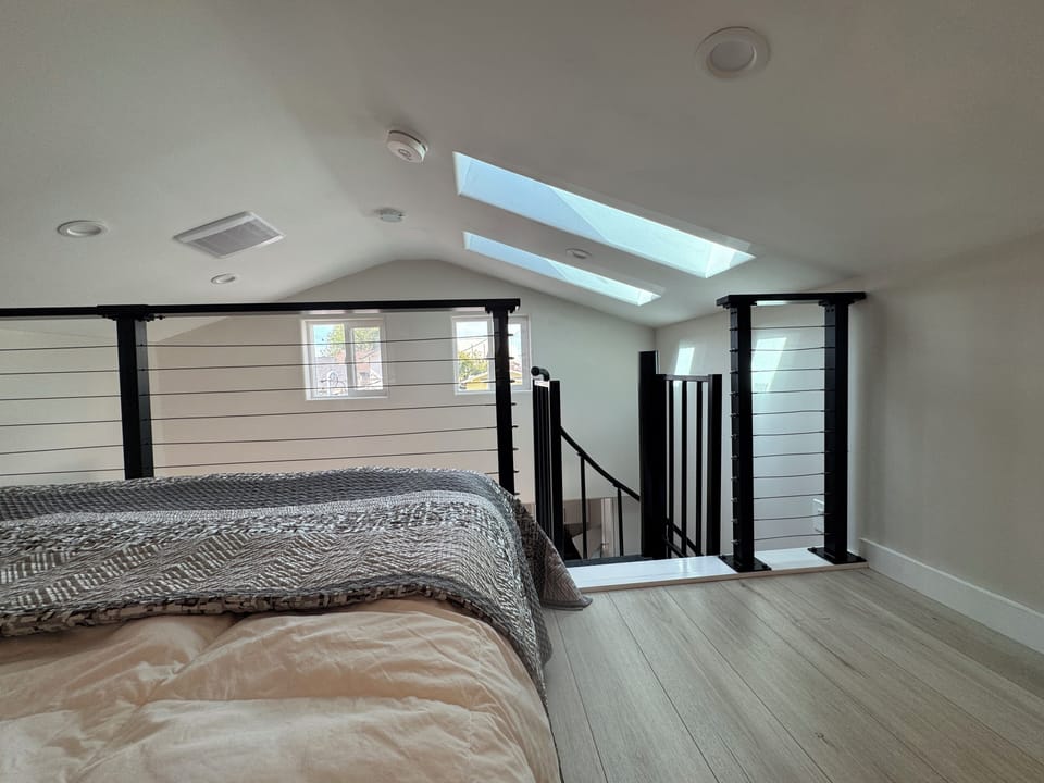 The view from the bed to the roofline windows and skylights.