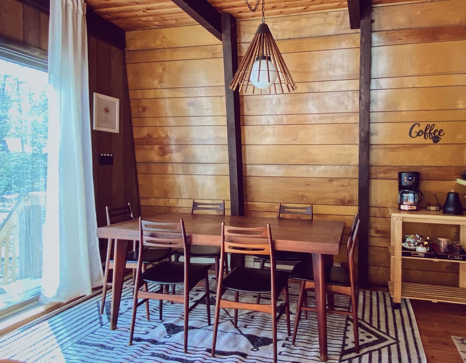 Mid-century modern dining area with coffee bar.