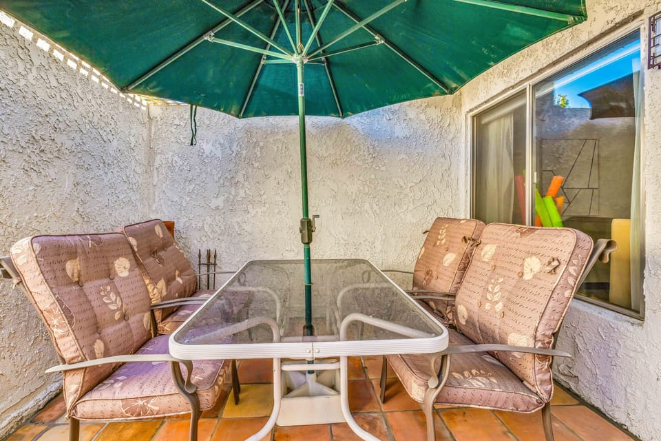 Shaded patio dining area perfect for outdoor meals and evening cocktails