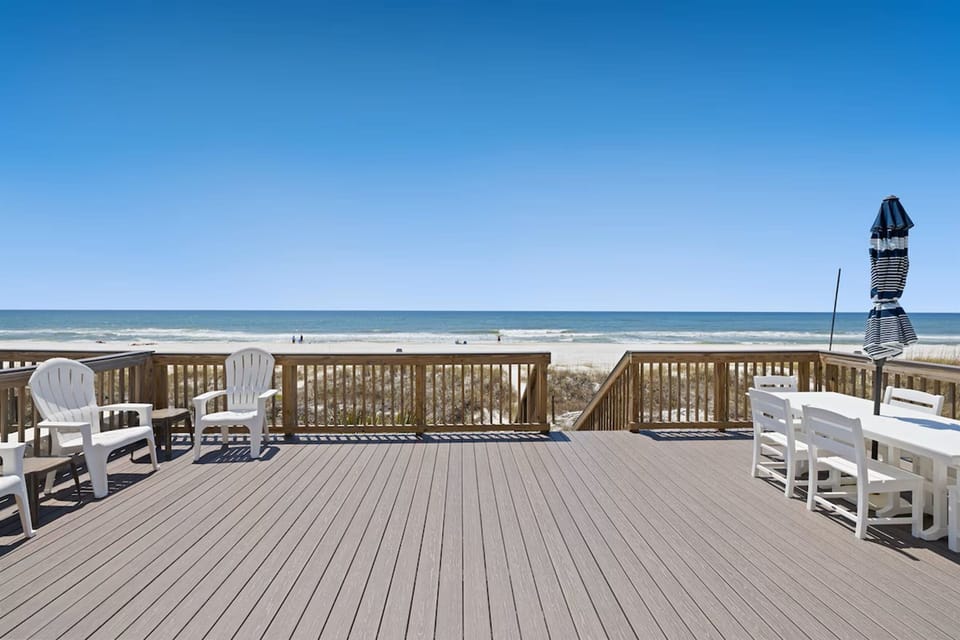 Relax in your private beachfront paradise where morning coffee meets ocean breeze on this expansive deck.