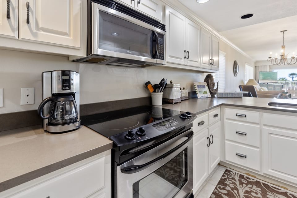 Whip up your morning coffee in this bright, fully-equipped kitchen with modern appliances and ample counter space for your vacation meal prep.