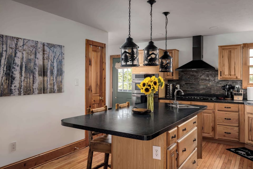 Kitchen with a spacious island—great for chopping, chatting, and keeping everyone close.