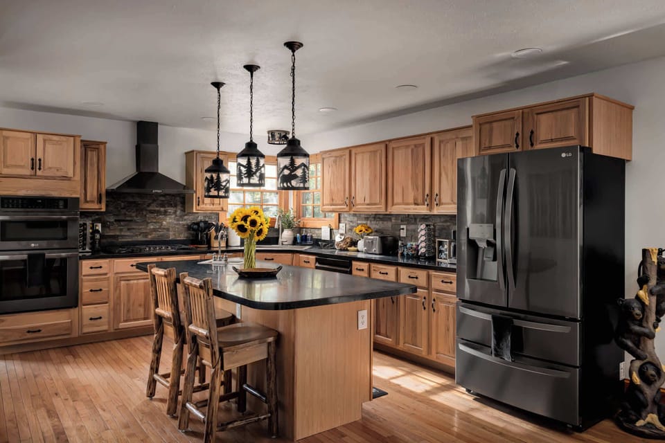 Kitchen with a roomy island—perfect for cooking together and lingering over breakfast plans.