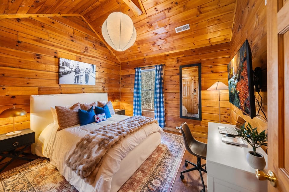 Enjoy a comfy queen bed and a dedicated work table