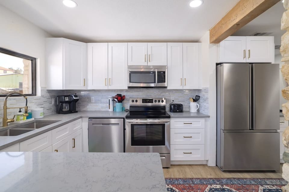Cook, gather, and unwind in a bright modern kitchen stocked for everything from slow breakfasts to family dinners. Clean lines, warm finishes, and open flow make every meal feel effortless.