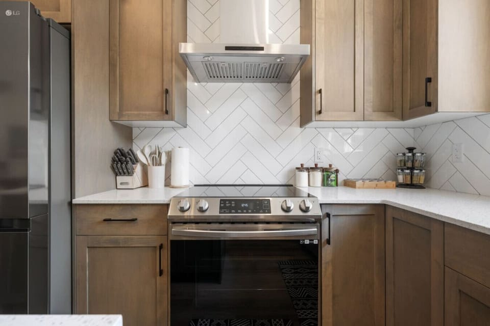 Elevate Your Cooking Experience In Our Well-Designed Kitchen Featuring A Unique Stone Stove