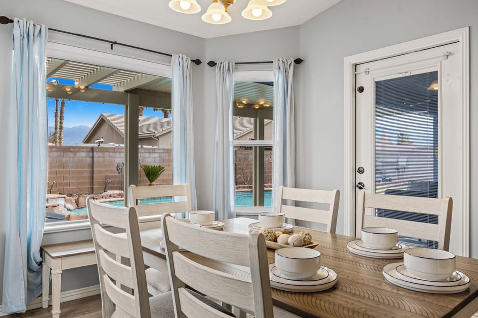 Dining room with a bench to see out to the pool.