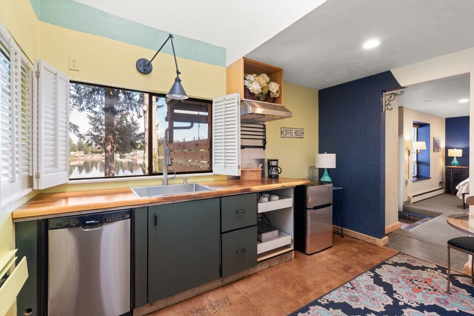 mini fridge, sink, counter in 2nd bedroom area
curtain dividing bedrooms