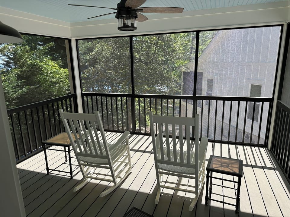 Screened in porch with overhead fan attached directly to the bungalow