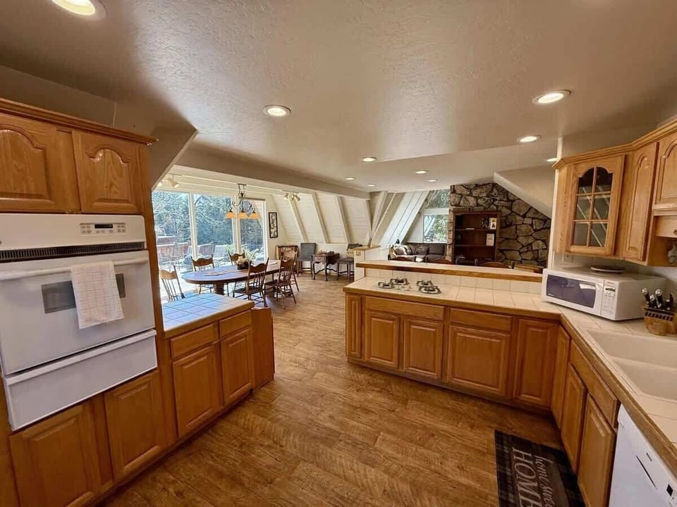Kitchen with gas cooktop and smaller gas oven.