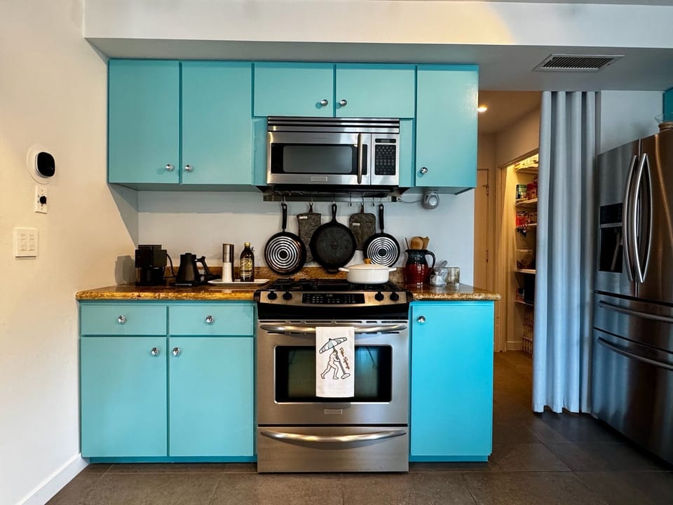 Colorful kitchen equipped with everything a home cook needs to entertain