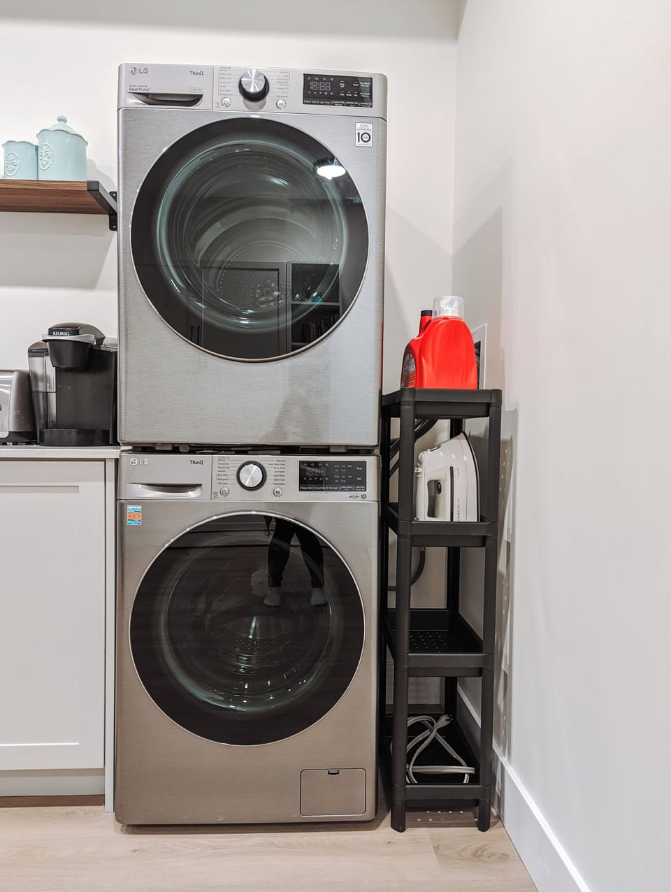 Washer, dryer, iron, and laundry detergent to keep clothes clean and fresh.