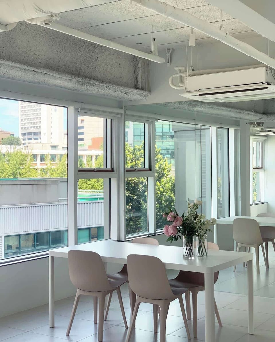 Spacious living room with a table for 4, a large sofa, and a great view.  Flexible office space.  View from the office.