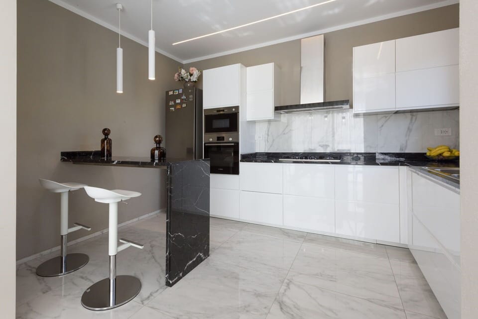 Furniture, Kitchen, Interior Design, Flooring, Countertop, Wood, Floor, Cabinetry, Ceiling, Kitchen Appliance