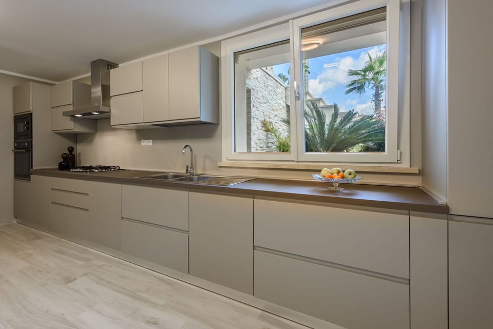 Kitchen, Countertop, Kitchen Appliance, Major Appliance, Flooring, Interior Design, Wood, Cabinetry, Home Appliance, Home