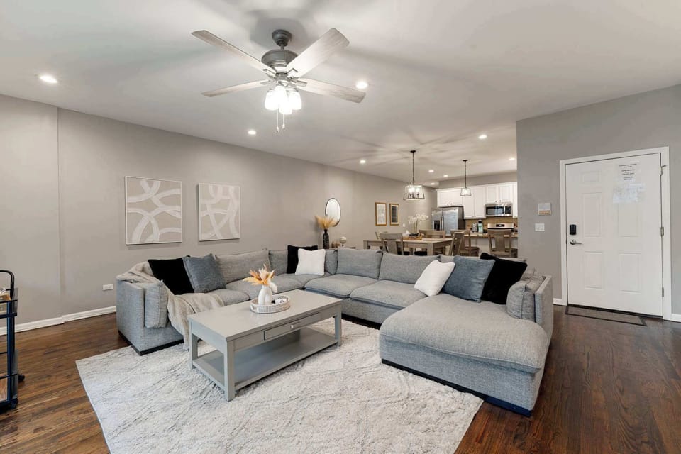Bright open living area w/ plush seating & soft tones that make it easy to relax after a full day
