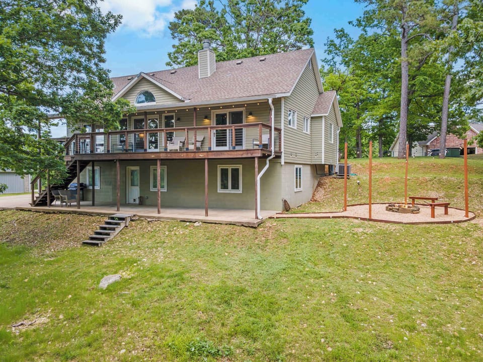 Enjoy the outdoors among the trees in a peaceful neighborhood on Beaver Lake.