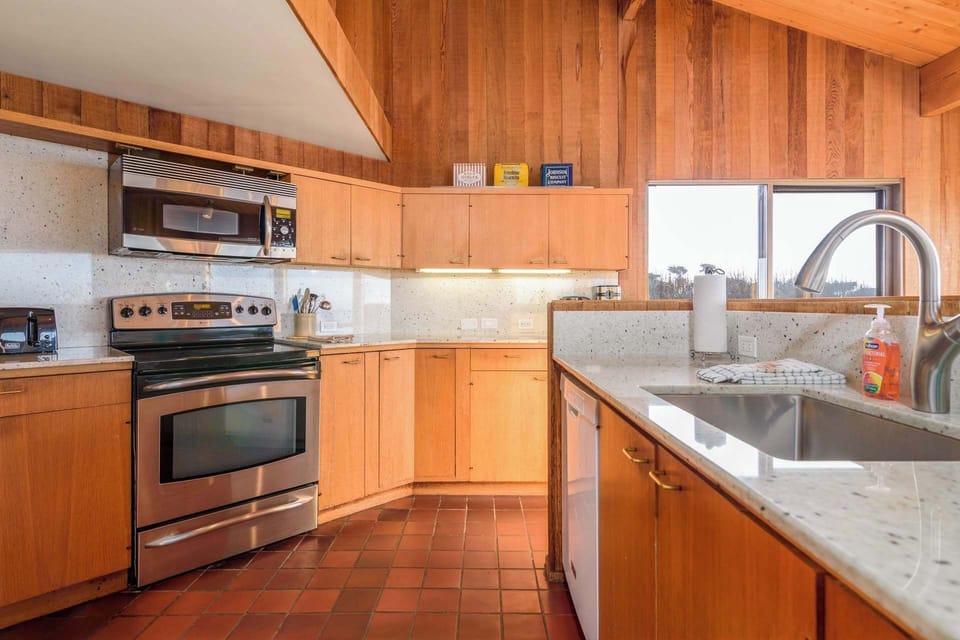 The breezy kitchen offers ample space & every home comfort