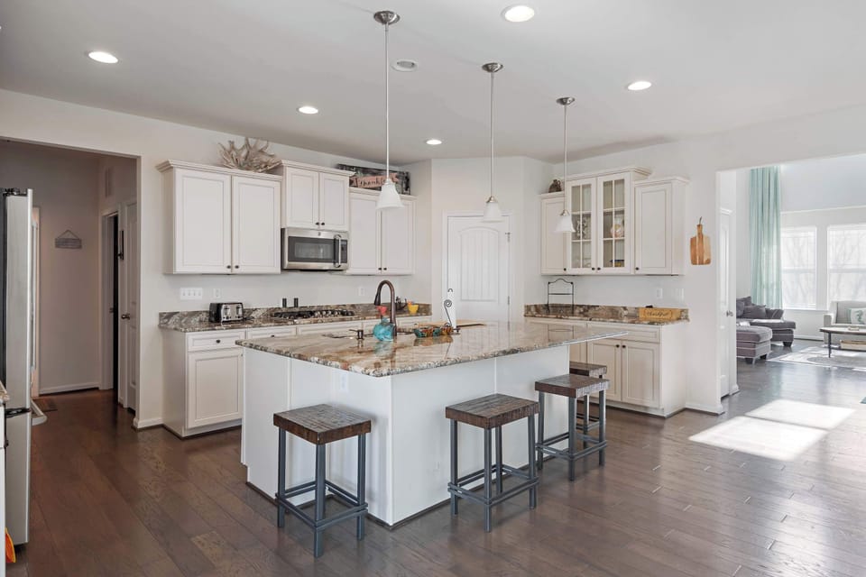 The open, airy kitchen offers ample space & all the comforts of home