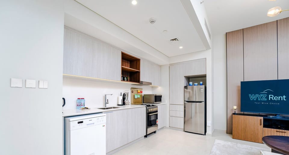 Full Kitchen  with fitted appliances such as stove ,microwave a refrigerator